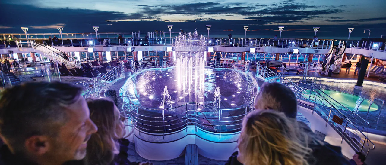 A glittering water show on the pool deck choreographed with colours and music