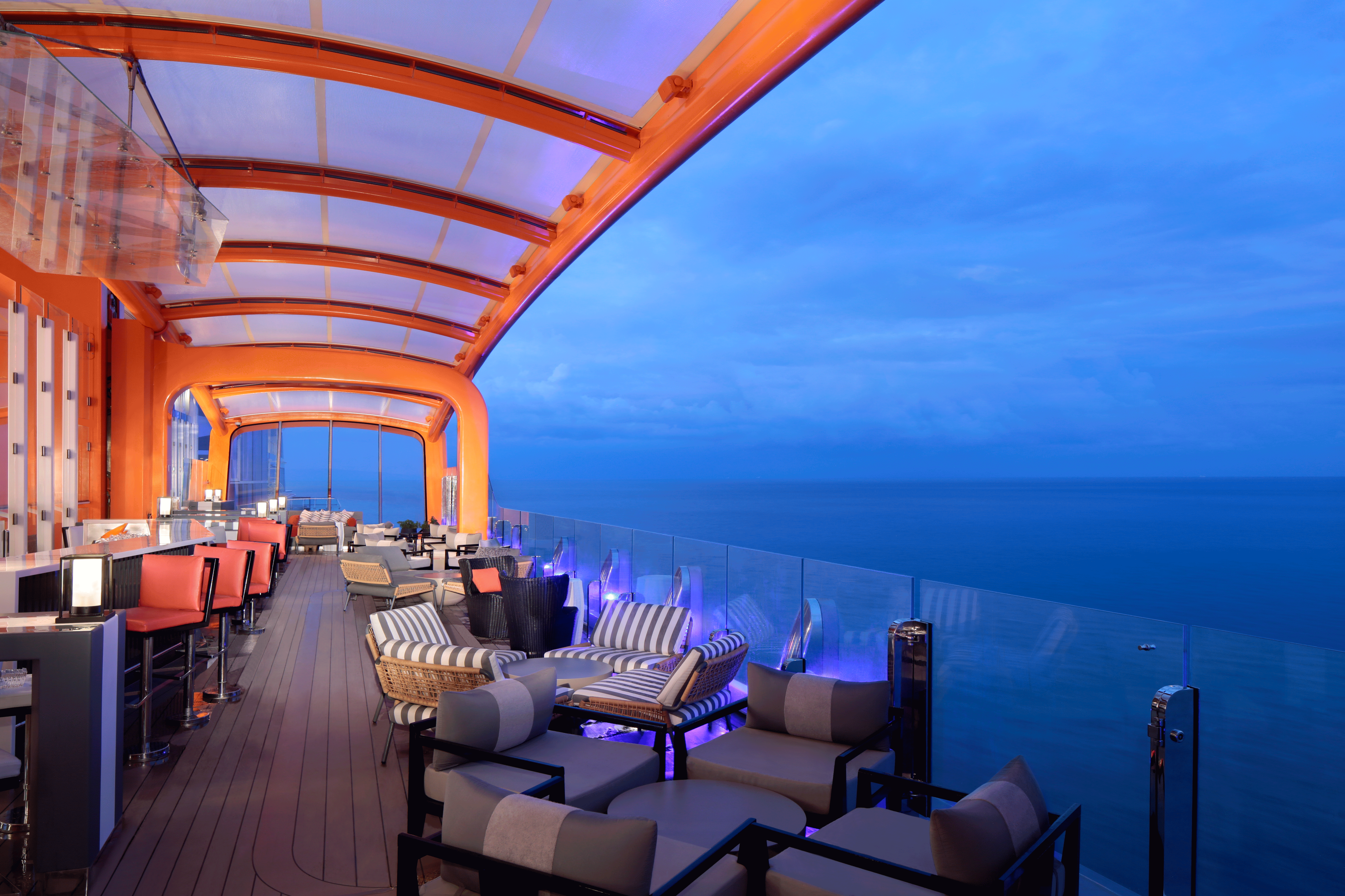 Dine, drink, and soar above the sea on the Magic Carpet, the world’s first cantilevered, floating platform