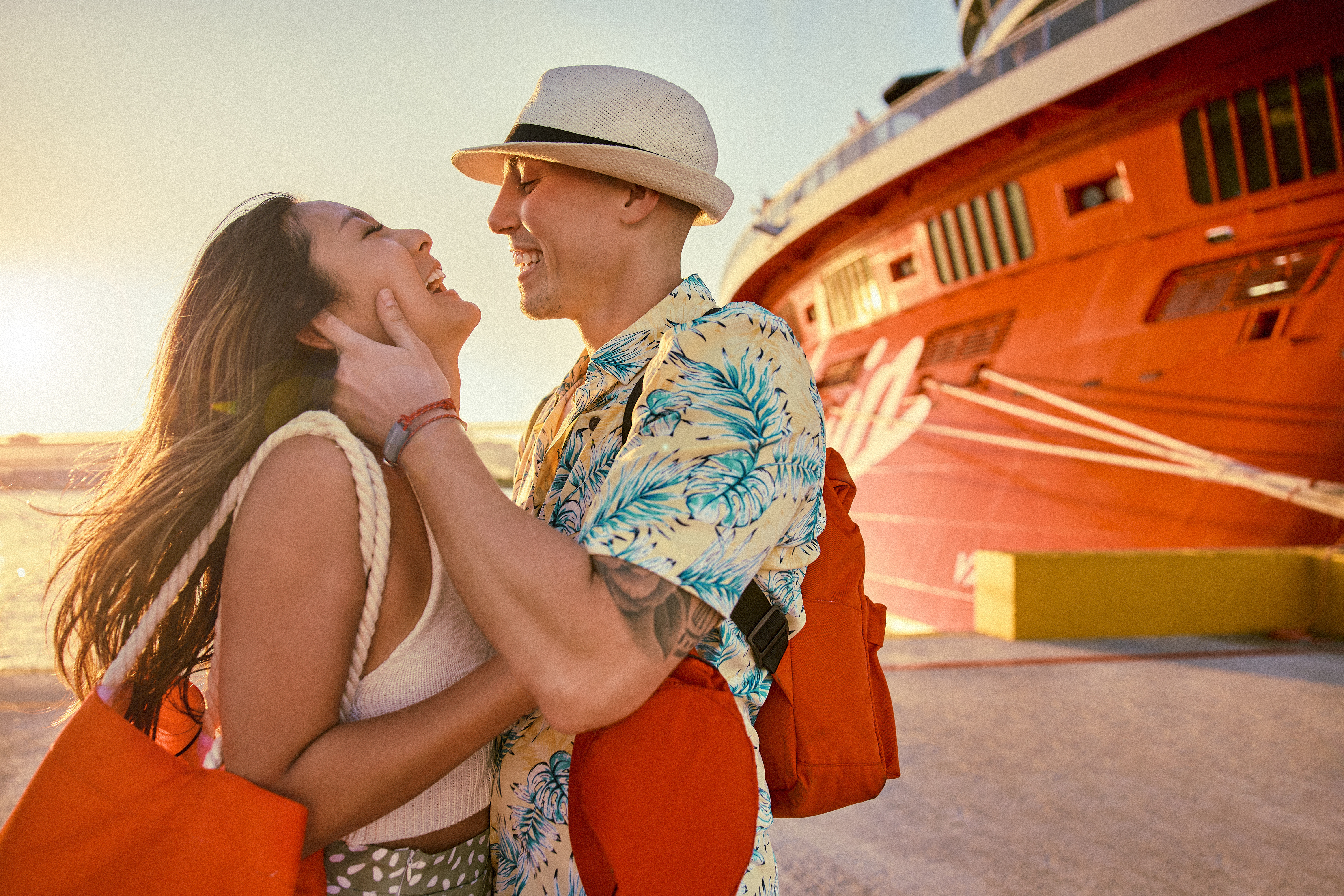 Couple outside of a Virgin Voyages ship