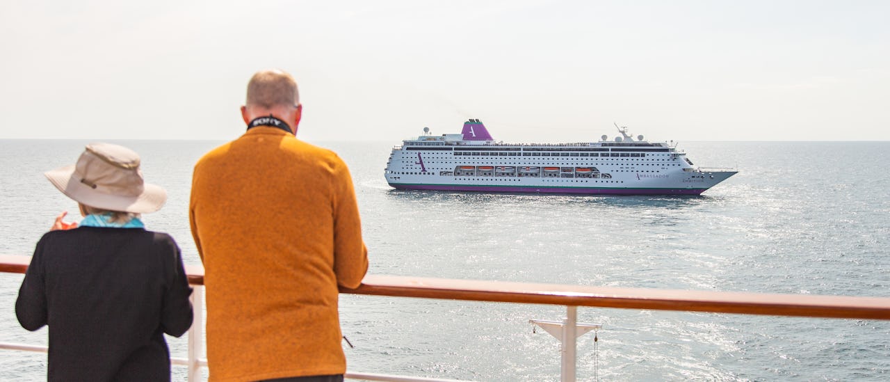 Guests looking out to Ambition at sea