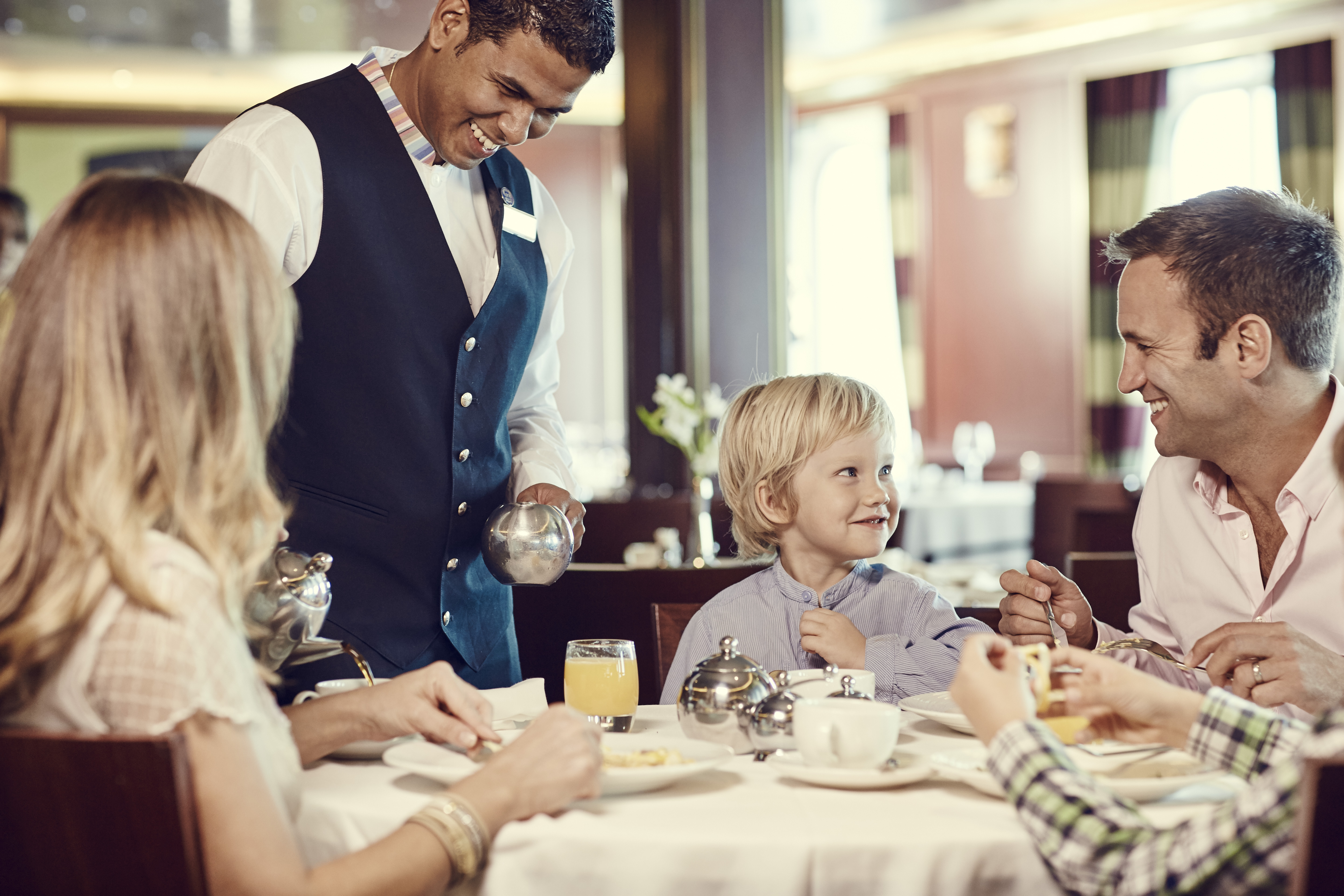 A family enjoying a meal on a P&O Cruises ship