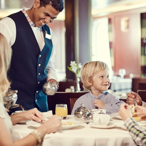 A family enjoying a meal on a P&O Cruises ship