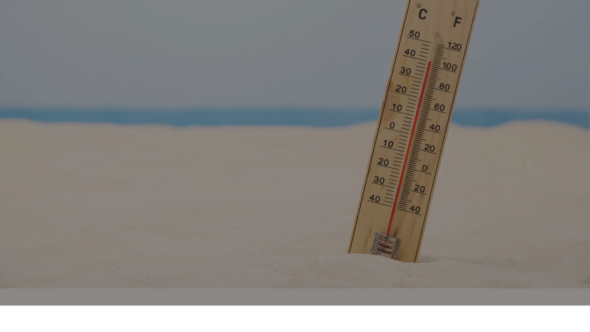 Thermometer on beach