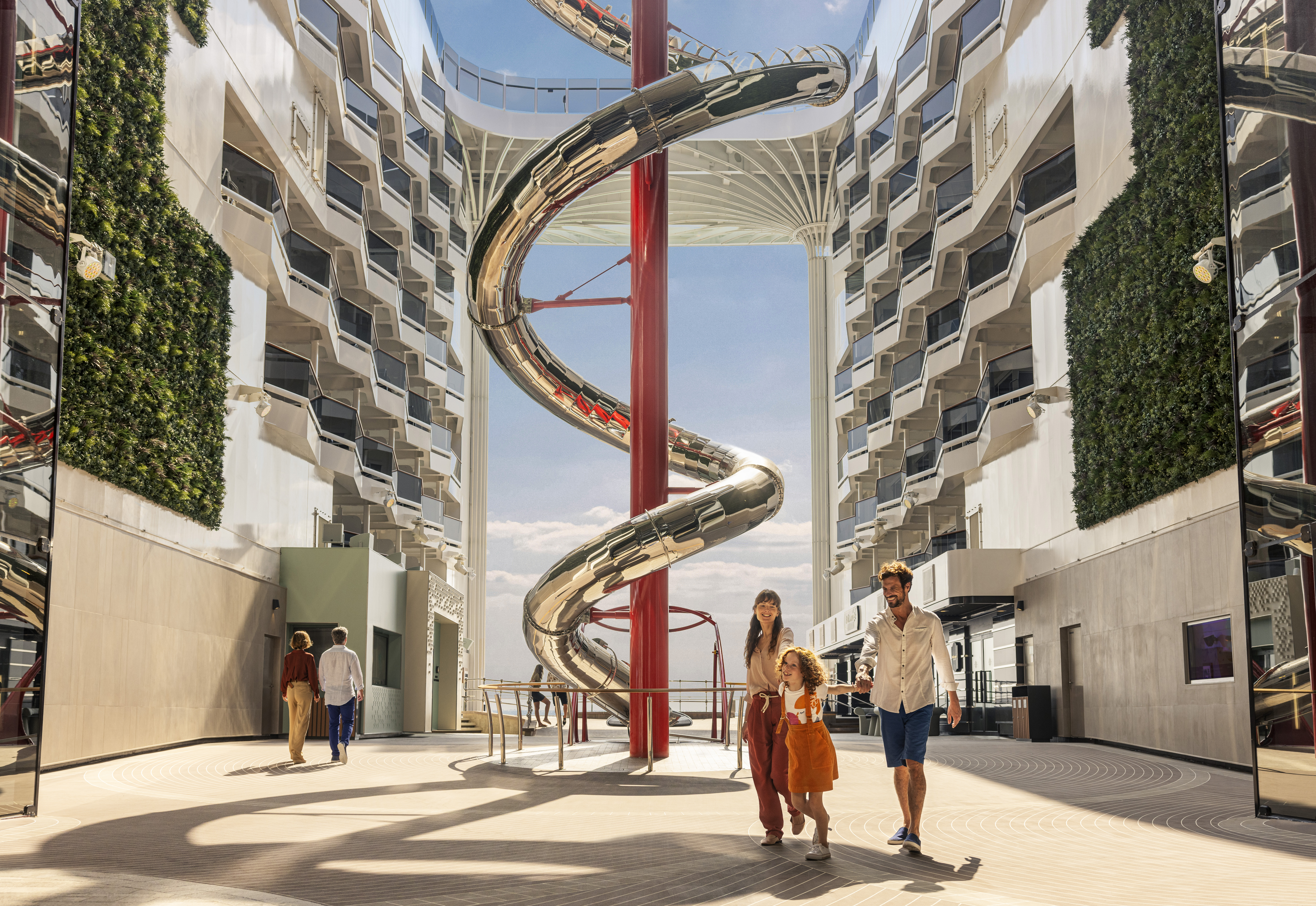 Family in front of venom drop slide on MSC World Europa