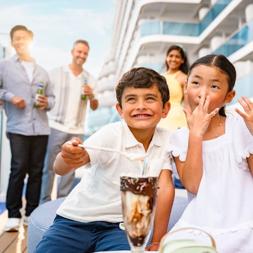 Kids eating ice cream on Sun Princess with family behind