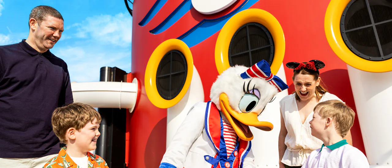 Family on Disney Ship with Daisy Duck