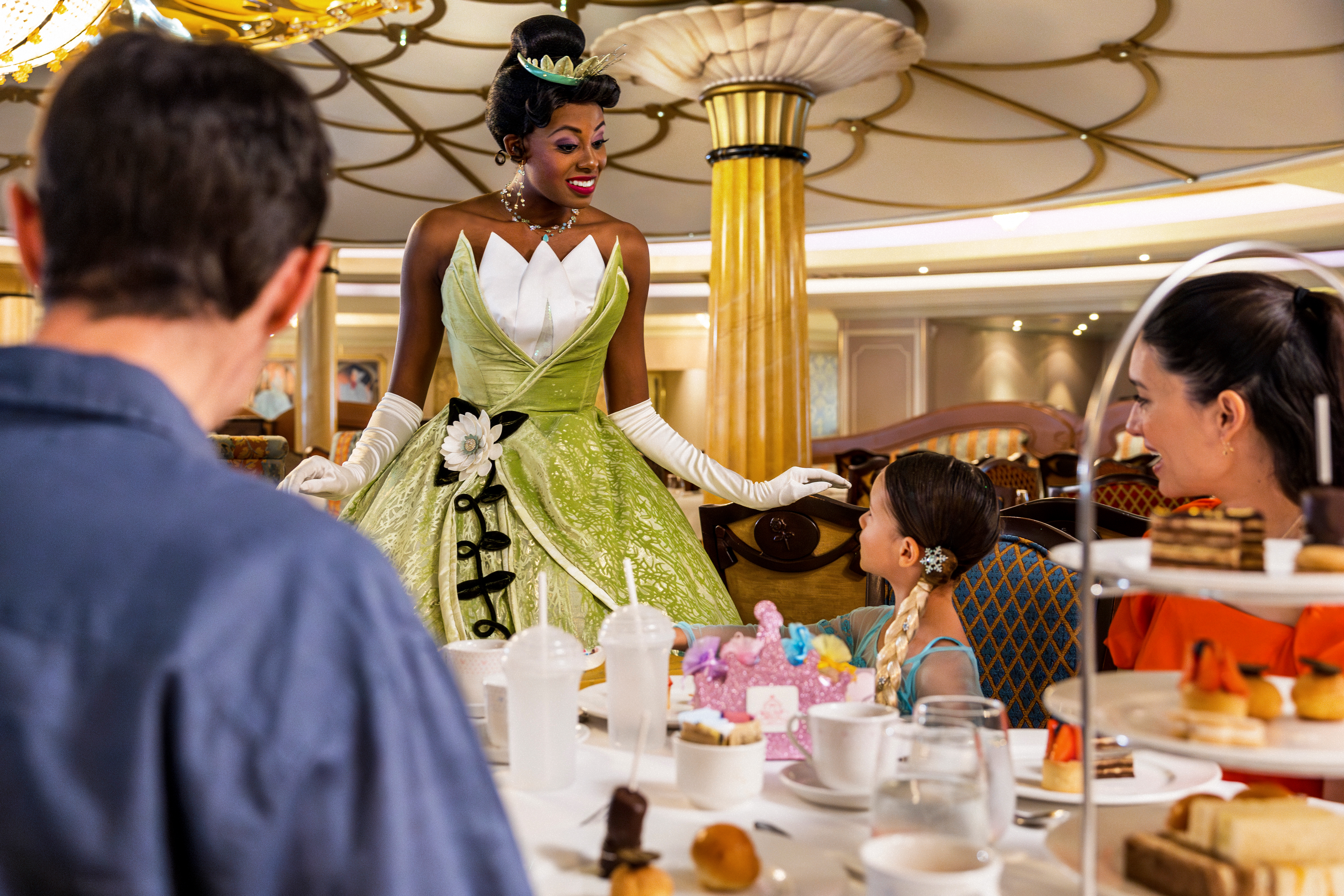 Princess Tiana with guests on Disney ship