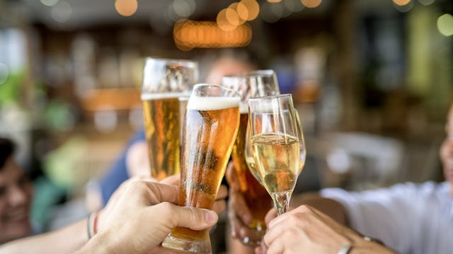 generic image of people doing a cheers with drinks